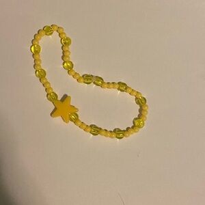yellow hand made beaded bracelet with star